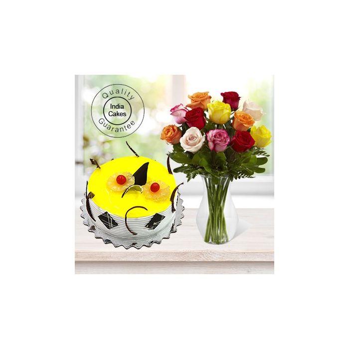 Eggless Pineapple Cake Half Kg with 12 Mix Roses Bunch Eggless Pineapple Cake Half Kg with 12 Mix Roses Bunch