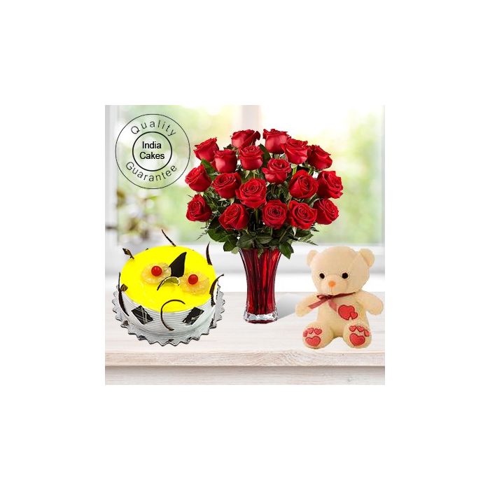 Eggless Pineapple Cake 1 Kg with 6 Red Roses Bunch and a Teddy Bear Eggless Pineapple Cake 1 Kg with 6 Red Roses Bunch and a Teddy Bear