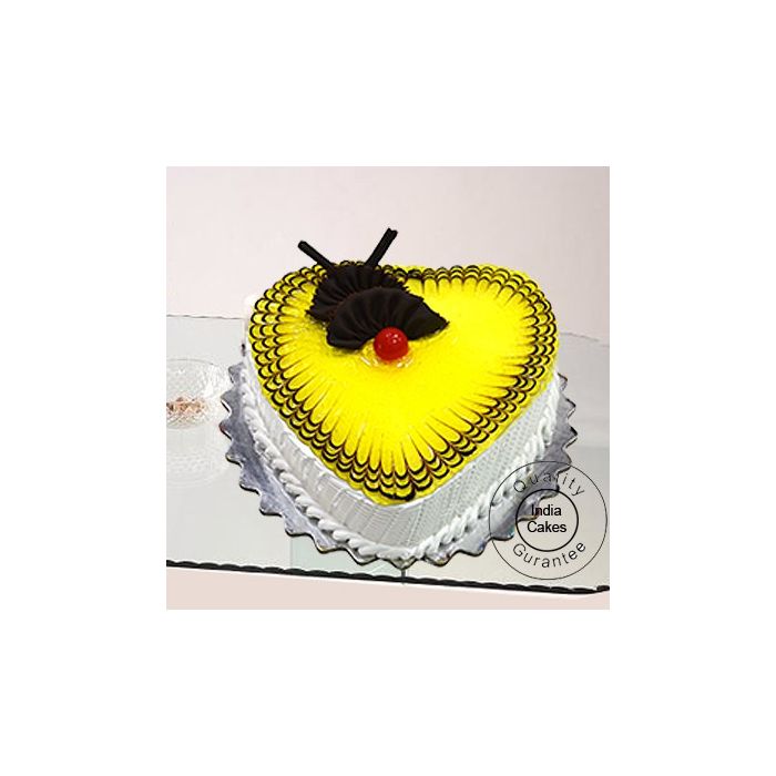 Eggless Pineapple Cake 1 Kg Heart Shape Eggless Pineapple Cake 1 Kg Heart Shape