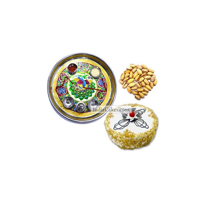 Golden Thali With Green Design And Half Kg Eggless Butterscotch Cake And 250 gms Pista Dryfruits Golden Thali With Green Design And Half Kg Eggless Butterscotch Cake And 250 gms Pista Dryfruits