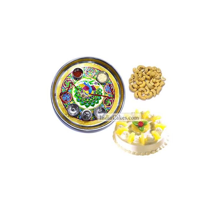 Golden Thali With Green Design And Half Kg Eggless Pineapple Cake And 250 gms Cashew Dryfruits Golden Thali With Green Design And Half Kg Eggless Pineapple Cake And 250 gms Cashew Dryfruits