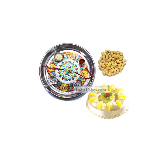 Silver Thali With Design And Half Kg Eggless Pineapple Cake And 250 gms Cashew Dryfruits Silver Thali With Design And Half Kg Eggless Pineapple Cake And 250 gms Cashew Dryfruits