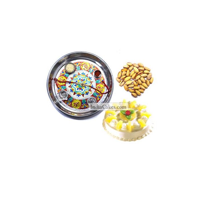 Silver Thali With Design And Half Kg Eggless Pineapple Cake And 250 gms Pista Dryfruits Silver Thali With Design And Half Kg Eggless Pineapple Cake And 250 gms Pista Dryfruits