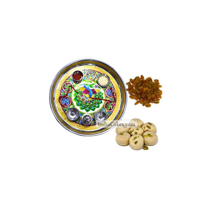 Golden Thali With Green Design And Pedha With Raisins Dryfruits Golden Thali With Green Design And Pedha With Raisins Dryfruits