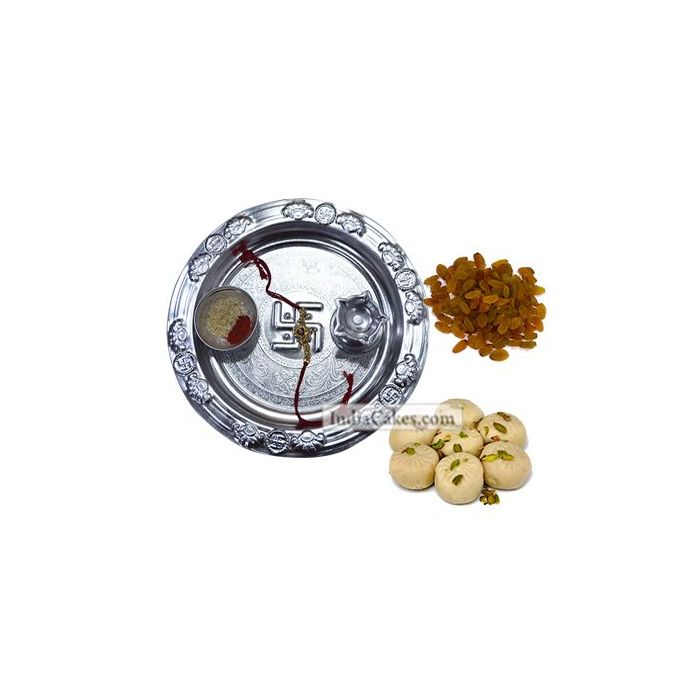 Silver Thali And Pedha With Raisins Dryfruits Silver Thali And Pedha With Raisins Dryfruits
