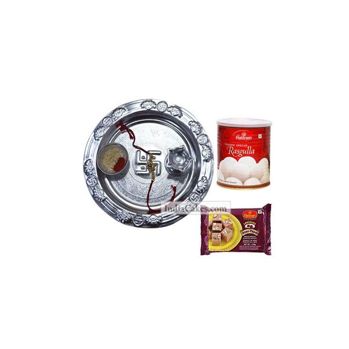 Silver Thali And Rasgulla With Soanpapdi Silver Thali And Rasgulla With Soanpapdi